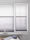 Honeycomb shades or cellular shades on a window, providing energy efficiency, insulation, and stylish light control