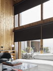 Modern roller shades in a living room, offering sleek design, light control, and privacy for contemporary homes