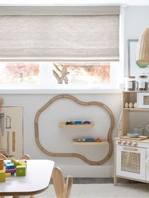 Kids' room window treatments with roller shades offer safety, light control, and playful design options