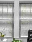 Wood blinds in Laredo Pewter finish feature a sleek and modern design that adds warmth and sophistication to any room.