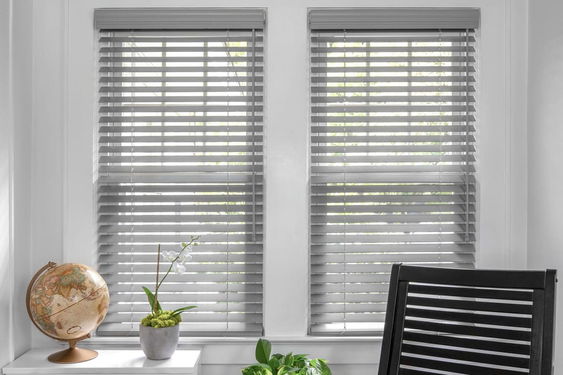 Wood blinds in Laredo Pewter finish feature a sleek and modern design that adds warmth and sophistication to any room.