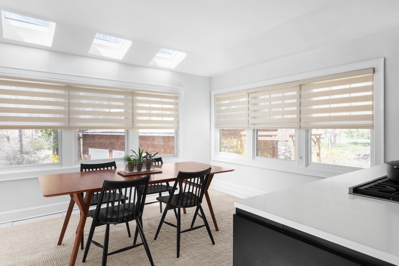 Tan-colored Cascade sheer shades in a modern dining room