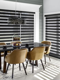 Cascade shades or zebra shades in a dining room, provide versatile light control and a modern, stylish look