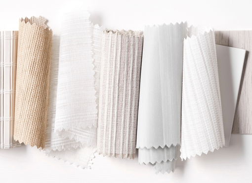 A group of window treatment swatches that fit in well with coastal and beach house decor.