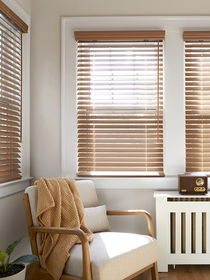 Real wood blinds with a valance, adding natural warmth, elegance, and polished style to any window