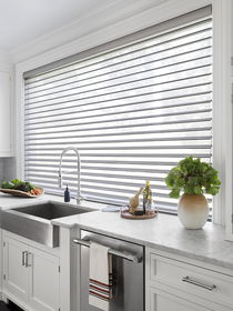 Serenity sheer shades in a modern kitchen with a large window, offering soft light filtering and a sleek, elegant look