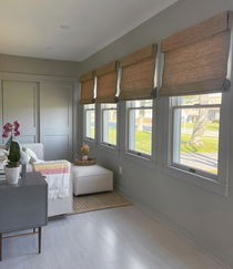 Entryway with elegant blinds enhancing the space's brightness.