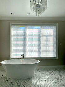 Spacious bathroom with stylish blinds