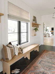 Entryway with elegant blinds enhancing the space's brightness.