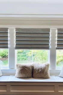 Classic fold Roman shades in a lovely sitting nook