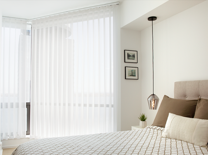 Vertical sheers offer privacy without blocking the view in modern living room.