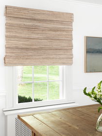 Woven wood shades featured on the window add a natural, stylish touch to enhance any room's decor